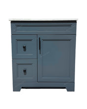 Dark grey bathroom vanity with drawers.