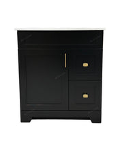 30" black bathroom vanity with gold handles and white countertop.
