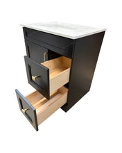 Black vanity cabinet with open drawer and quartz countertop.