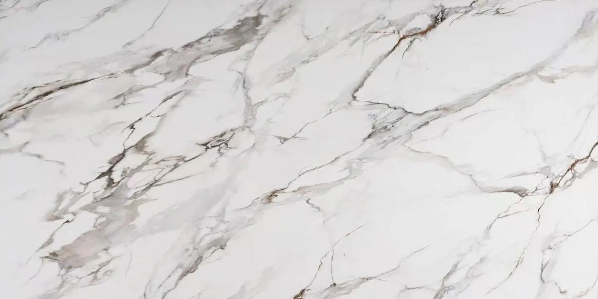 Calacatta Bloom white quartz countertop slab with grey veining and copper accents