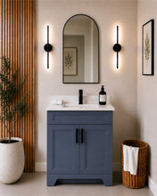 Pearl 30" dark grey bathroom vanity with black hardware and white quartz countertop, styled in a modern bathroom with wood slat accent wall