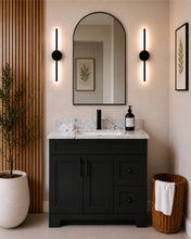 Pearl 36" black bathroom vanity with drawers, black hardware and white quartz countertop, styled in a modern bathroom with wood slat accent wall