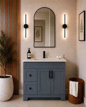 Pearl 36" dark grey bathroom vanity with drawers, black hardware and white quartz countertop, styled in a modern bathroom with wood slat accent wall