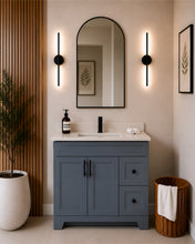 Pearl 36" dark grey bathroom vanity with drawers, black hardware and white quartz countertop, styled in a modern bathroom with wood slat accent wall
