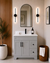 Pearl 36" light grey bathroom vanity with drawers, black hardware and white quartz countertop, styled in a modern bathroom with wood slat accent wall