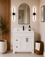 Pearl 36" white bathroom vanity with drawers, black hardware and white quartz countertop, styled in a modern bathroom with wood slat accent wall
