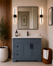 Pearl 42" dark grey bathroom vanity with drawers, black hardware and white quartz countertop, styled in a modern bathroom with wood slat accent wall