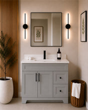 Pearl 42" light grey bathroom vanity with drawers, black hardware and white quartz countertop, styled in a modern bathroom with wood slat accent wall