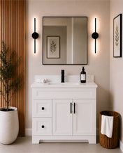 Pearl 42" white bathroom vanity with drawers, black hardware and white quartz countertop, styled in a modern bathroom with wood slat accent wall