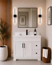 Pearl 42" white bathroom vanity with drawers, black hardware and white quartz countertop, styled in a modern bathroom with wood slat accent wall