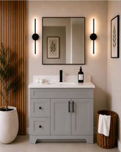 Pearl 42" light grey bathroom vanity with drawers, black hardware and white quartz countertop, styled in a modern bathroom with wood slat accent wall