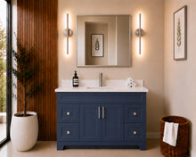 Pearl 48" navy blue bathroom vanity with drawers, brushed nickel hardware and white quartz countertop, styled in a modern bathroom with wood slat accent wall
