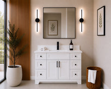 Pearl 48" white bathroom vanity with drawers, black hardware and white quartz countertop, styled in a modern bathroom with wood slat accent wall