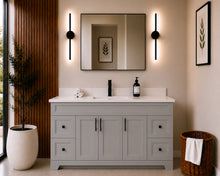 Pearl 60" light grey single sink bathroom vanity with black hardware and white quartz countertop, styled in a modern bathroom with wood slat accent wall