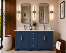 Pearl 60" navy blue double sink bathroom vanity with brushed nickel hardware and white quartz countertop, styled in a modern bathroom with wood slat accent wall