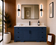 Pearl 72-inch navy blue single-sink bathroom vanity with black hardware, quartz countertop, and matte black faucet, styled in a modern bathroom with a black-framed mirror, black wall sconces, and wood slat accent wall.